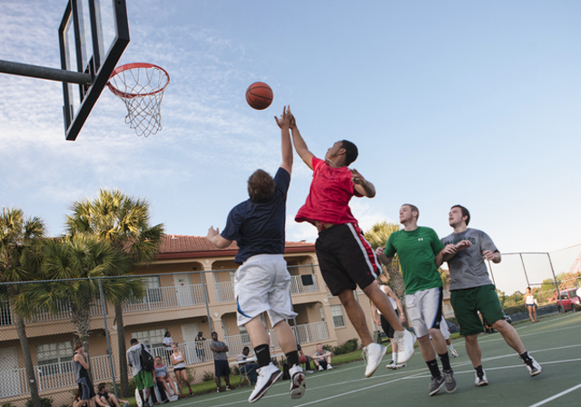 Students play intramural basketball on campus