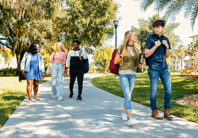 undergraduate students walking together on campus