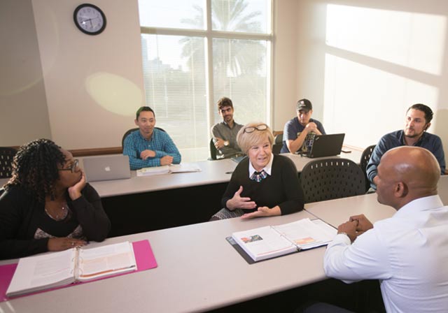 Saint Leo students and instructor in classroom