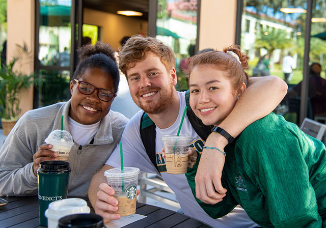 Group of students having coffee on campus