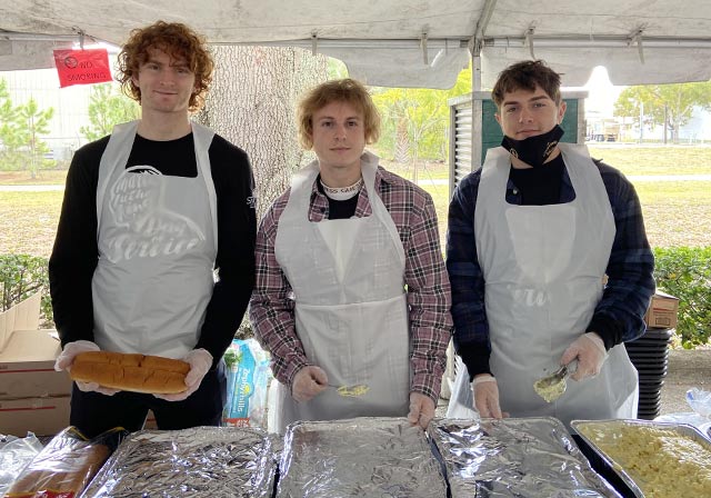 Saint Leo University students volunteering to serve food