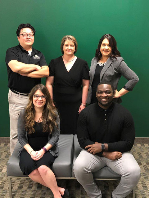 In this photo of the Saint Leo Ocala Education Center staff: sitting are Amanda Harrison, student advisor and Antron McCullough, student advisor;<br />
  standing are Francis Lai, student advisor, Deborahlynn Tucker, staff assistant, and Rena Thomas, center director</p>
<p>  