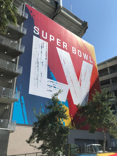 A photo showing a Super Bowl LV sign outside of Raymond James Stadium in Tampa, FL on Super Bowl Sunday for Super Bowl LV when several Saint Leo University students got to volunteer at Super Bowl events.