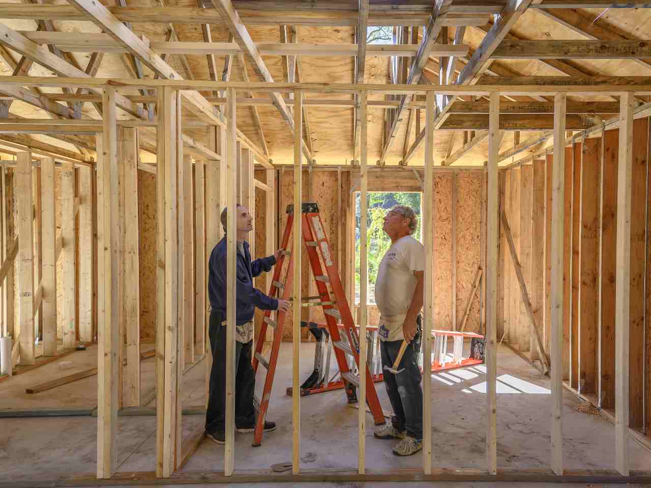 Construction photo featuring Gary Howard, left, from Tampa Student Support Center, Saint Leo Serves Community, Honors Spirit of MLK