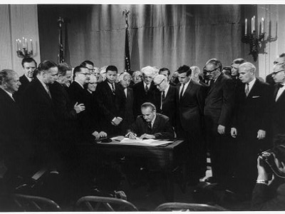 President LBJ signs Civil Rights Act in 1964