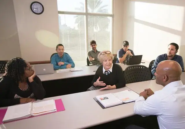 Saint Leo students and instructor in classroom