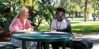 Two students studying outside