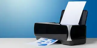A printer with a paper on it.