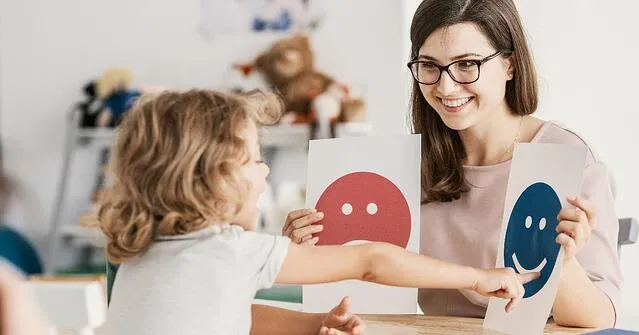 A woman teaching a child