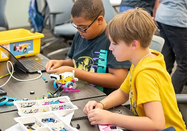 Campers work on their robot