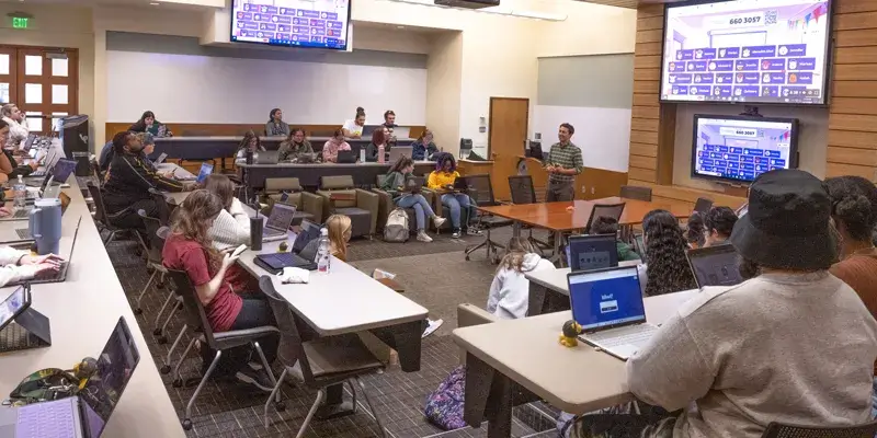 A photo of the students in one of the sections of the Wild Florida honors class offered at Saint Leo University in the fall of 2022; the students are pictured in TECO Hall sitting at their desks, many of whom are using laptops