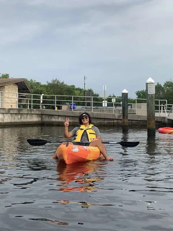 A photo of Rafael Soto, a current political science degree student at Saint Leo University, riding in a kayak as part of a trip led by University Ministry