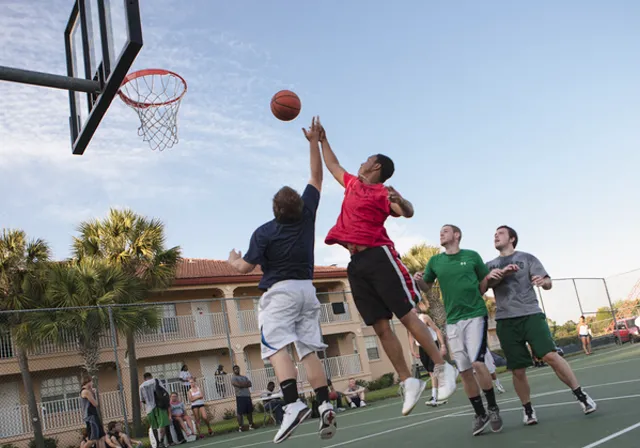 Students play intramural basketball on campus