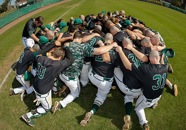 Saint Leo baseball team prays together after game