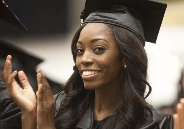 Saint Leo University student attending graduation