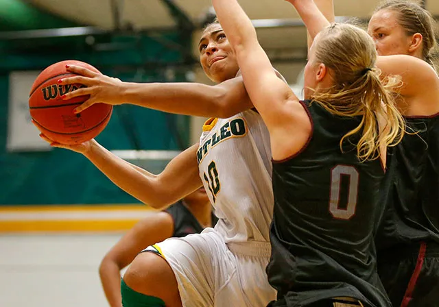 Saint Leo women's basketball team member makes a layup