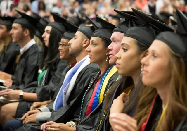 image of students sitting and listening during commencement