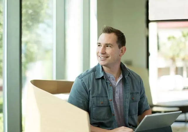 image of student with laptop
