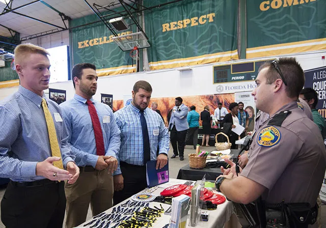 Students meet with employers at career fair