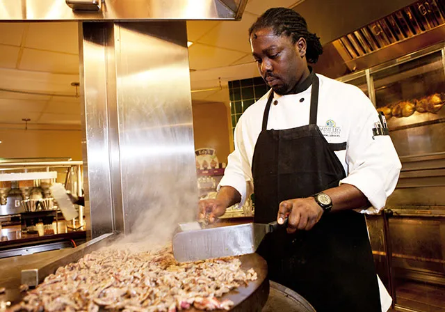 Saint Leo chef cooking in the dining hall