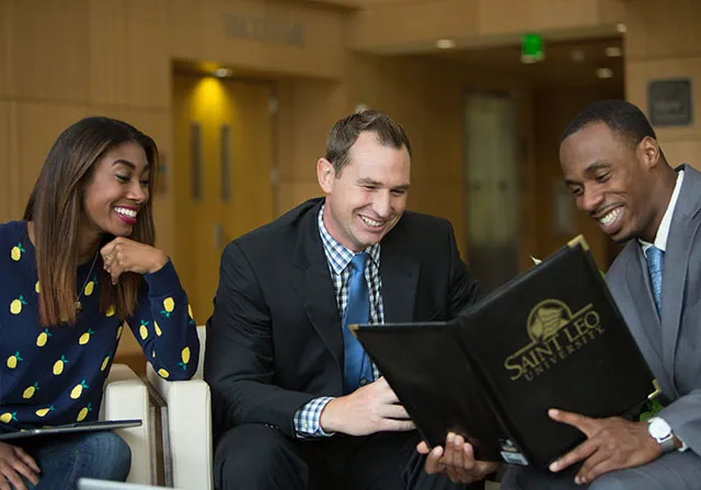 Saint Leo online students at a networking event.