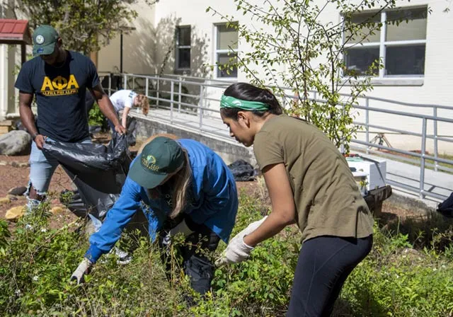Saint Leo University students performing community service on campus
