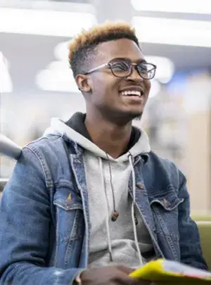 university campus student holding notebook