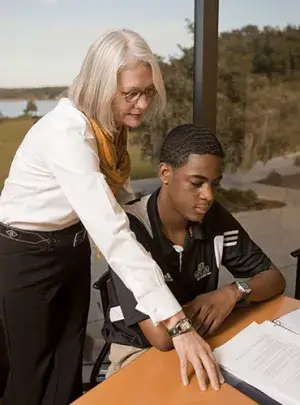 A member of student financial services talk with a student