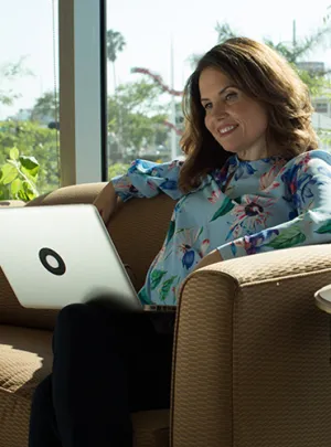 Online student sitting with laptop