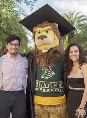 students standing for portrait with school mascot
