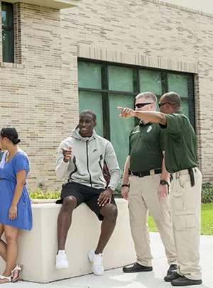A student talks with the Campus Security team