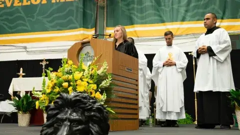 Caitlin Markey delivers prayers of the faithful