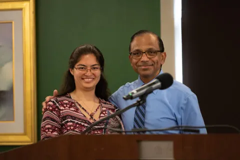 Chrisalyn Junkert receives School of CARDS Deans Award from Dr. Vyas Krishnan