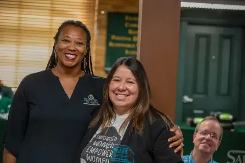 Dr. Ebony Perez presents Christina Cazanave with NASW Social Work Educator of the Year award