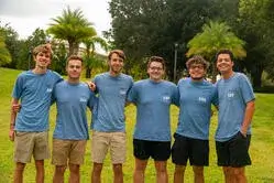 A photo with a group of Sigma Alpha Epsilon fraternity brothers posing together in the bowl at Saint Leo’s University Campus; they are all wearing their fraternity shirts