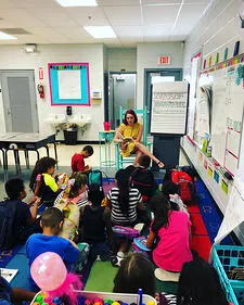 Savannah Hall Saint Leo education degree alumna reading to students