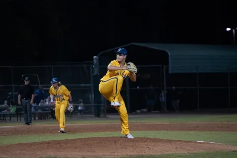 A photo of Andy Booth, a Saint Leo University sport business degree student and pitcher for the Saint Leo baseball team, pitching in a game for the Savannah Bananas