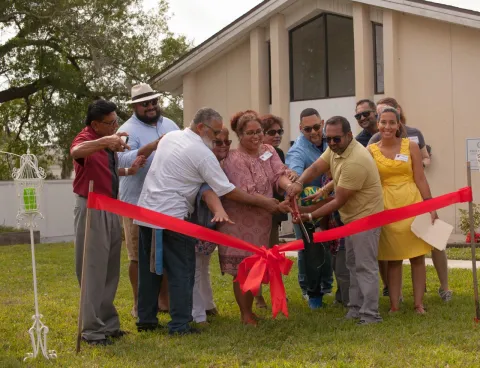 A photo of the ribbon-cutting ceremony when Inspire to Rise, Inc. officially opened its doors in April of 2019; there are four Saint Leo alumni who have helped build this nonprofit organization based in the Jacksonville, FL area 