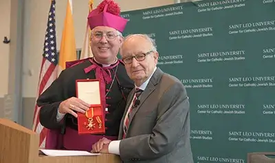 Rabbi A. James Rudin receives the medal of the Papal Knighthood of the Order of St. Gregory from Bishop Mark O’Connell