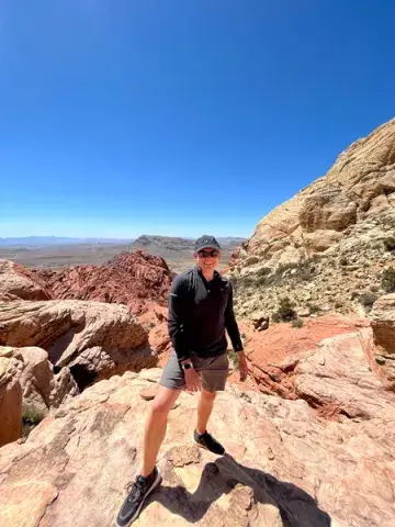 A photo of KJ Ryan, a Saint Leo University communication major, standing in a canyon during the summer of 2022 when he completed his public relations internship in Las Vegas