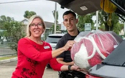 Teddy-bears-for-TPD-handing-bear