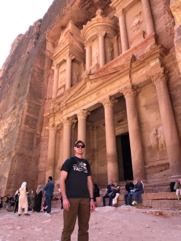A photo of Chris Swonger, a captain in the U.S. Army and alumnus of the Saint Leo ROTC program, standing in front of ‘Petra,’ a popular tourist attraction in the country of Jordan in 2021