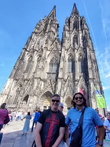 A photo of Rafael Soto, a current political science degree student at Saint Leo University, posing for a photo with fellow student Jeremy Bobowski in front of the Cologne Cathedral in Cologne, Germany in the summer of 2022 when the two Saint Leo students attended the Catholic Worldview Fellowship