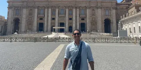 A photo of Rafael Soto, a current political science degree student at Saint Leo University, posing for a picture in Rome, Italy when he participated in the Catholic Worldview Fellowship trip to Europe in the summer of 2022; he and the other students also spent time in Germany