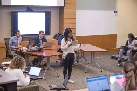 A photo of a debate between two teams of students in the Faith and Politics honors course at Saint Leo's University Campus in the spring of 2023