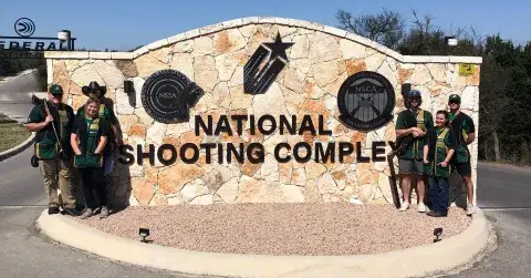 Saint Leo Sporting Clay members standing outside of the national shooting complex.