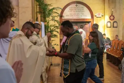 Student receiving communion