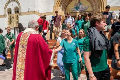 father-john-mcevoy-greeting-students-after-mass