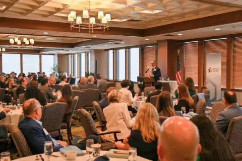 burkee-speaks-to-crowded-room