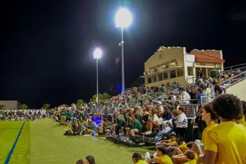 Saint Leo students show their spirit at a night-time game.